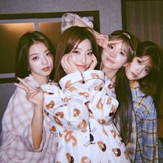 three young women posing for the camera in pajamas