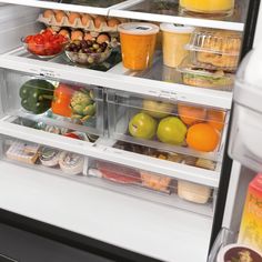 an open refrigerator filled with lots of different types of fruits and vegetables in it's doors