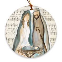 a ceramic ornament with an image of mary and jesus in the manger