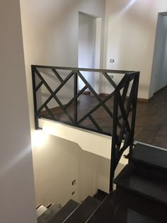 an empty room with stairs leading up to the second floor