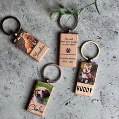 three keychains with pictures of dogs on them and the words buddy printed on them