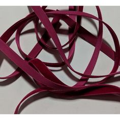 purple colored ribbon on white background