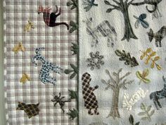 two quilts with animals and trees on them