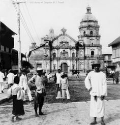 an old black and white photo of people in front of a church