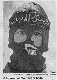 a man wearing a ski mask with words on it