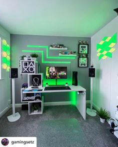 a room with green and yellow lights on the wall, computer desk in front of it