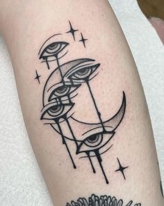 a black and white photo of a tattoo on someone's arm with the moon in it