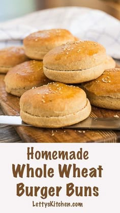 homemade whole wheat burgers on a cutting board with the words, homemade whole wheat burgers