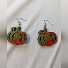 Nwt Beautiful Wooden Green& Orange Dangle Pumpkin Fall Themed Earrings. Great For Fall Outfits. Location: Small Closet Accessories Clear Bin Clear Bins, Closet Accessories, Small Closet, Pumpkin Fall, Boutique Jewelry, Autumn Theme, Ladies Boutique, Green Orange, Fall Pumpkins