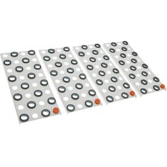 four pieces of white and orange polka dot paper with holes on each side, set against a white background