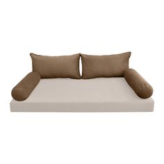 a bed with two pillows on it and one pillow in the shape of a couch