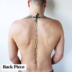 a man with a cross tattoo on his back