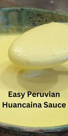 a spoon with some food in it on top of a bowl that says easy peruvanin havana sauce