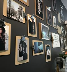 a wall covered in pictures and magnets with photos on them