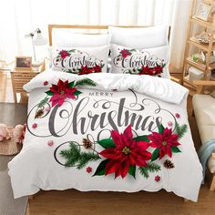 a christmas themed bed with poinsettis and pine cones