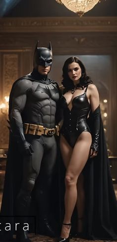 two women dressed up as batman and catwoman pose for a photo in front of a chandelier