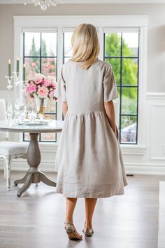 With a simple and elegant cut, this linen dress is designed to complement all body types. It has a contemporary hemline with classic style that can be worn anywhere from an office to evening out in the town. 100% Linen Made in Ukraine Sale items can be exchanged but not returned FINAL SALE Fitted Linen Dress For Work, Elegant Short Sleeve Linen Dress For Work, Elegant Linen Midi Dress With Short Sleeves, Elegant Short Sleeve Linen Midi Dress, Classic Knee-length Linen Dress For Workwear, Elegant Beige Linen Workwear Dress, Elegant Flax Colored Linen Day Dress, Formal Linen Midi Length Dress, Formal Linen Dress Midi Length