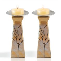 two candles are sitting next to each other