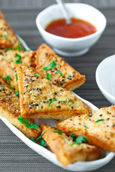 spicy prawn toast with everything bagel seasoning in a white serving dish