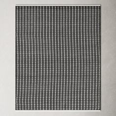 a black and white checkered cloth hanging on a wall