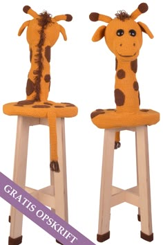 two giraffes are sitting on stools with legs