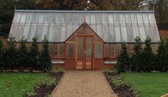 a house with a metal roof and glass windows