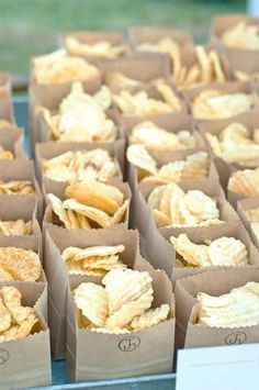 several boxes filled with chips sitting on top of a table