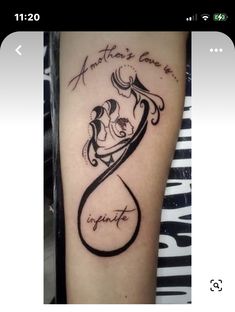 a tattoo with an image of two people in the shape of a heart and words on it