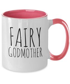 a pink and white coffee mug with the words fairy godmoter on it's side