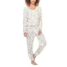 Discover the epitome of relaxation with the Honeydew Intimates Lounge Life Pajama Set, blending style and coziness into your loungewear collection. This jersey knit ensemble pairs a long-sleeve shirt, complete with a comfortable V-neck, with perfectly fitted pants featuring an elastic drawstring waist for a custom fit. Ideal for those lazy weekends or a tranquil night in, this set is your go-to for a cute, cozy experience. Feel pampered in the soft embrace of Honeydew Intimates' luxurious sleepw Comfortable Comfy Sleepwear, Cozy White Sleepwear For Loungewear, Comfy Sleepwear Pants For Lounging, White Comfortable Sleepwear, Comfy Long Pants Sleepwear For Lounging, Comfortable Relaxed Fit Sleepwear For Relaxing At Home, Comfortable Relaxed Fit Sleepwear For Home, Comfortable Relaxed Fit Sleepwear, Relaxed Fit Sleepwear