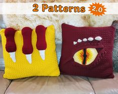 two pillows made to look like monster's eyes