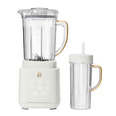 a blender with a cup next to it