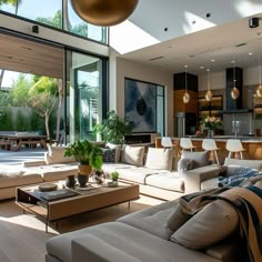 a living room filled with furniture and lots of windows