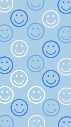 a blue and white background with many smiley faces