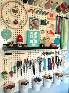 there are many craft supplies on the pegboard in this room, and it's easy to do