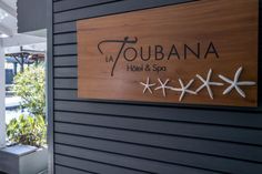 a sign on the side of a building that says la toubana hotel and spa