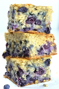 three blueberry breakfast cake with oats and blueberries stacked on top of each other