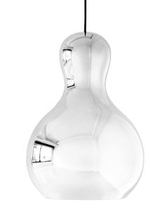 a clear glass vase hanging from a black cord on a white background with the light reflecting off of it's side