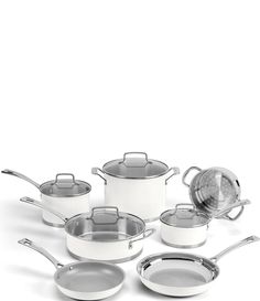 an assortment of pots and pans on a white background with the lid open to show what's cooking in them