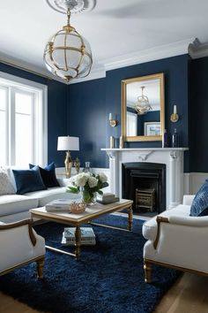 a living room filled with furniture and a fire place in front of a mirror on the wall