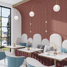 a restaurant with red brick walls and white tables, blue chairs, and gold accents