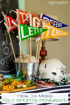 a football themed party with flags and snacks on the sidelines for sports fanaticss