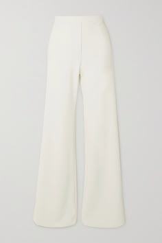 From Bianca Jagger to Emily Ratajkowski, so many stylish brides have opted for tailoring on their wedding day — why not follow 'suit' with Clio Peppiatt's flared pants? They're made from fully lined, ivory crepe blended with plenty of stretch and have a concealed side zipper for a streamlined finish. Wear them with the coordinating corset, then again long after your vows with blazers or camisoles. Tailored White Wide Leg Pants With Pressed Crease, Elegant White Wide Leg Pants With Pressed Crease, Formal White Wide Leg Pants With Pressed Crease, Fitted White Wide Leg Pants With Pressed Crease, Elegant Wide Leg Pants With Pressed Crease, Chic Cream Wide Leg Pants For Formal Occasions, Tailored Cream Wide Leg Pants For Formal Occasions, Classic Wedding Trousers, Elegant Tailored White Wide Leg Pants