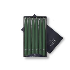 six green candles in a black box