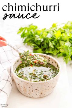 a white bowl filled with pesto sauce and garnished with cilantro