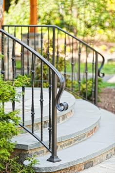 a set of stairs with wrought iron handrails