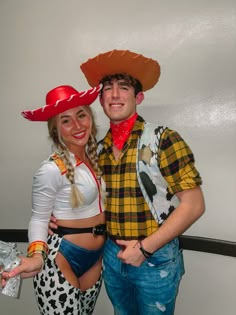 a man and woman dressed up in costumes