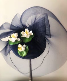 This romantic navy blue crinoline fascinator resembles a pond and is embellished with vintage water lily flowers. Attaches comfortably with an elastic strap hidden under the hair at the nape of the neck. Garden Party Hat, Tea Treats, 92nd Birthday, Tea Party Hats, Kentucky Derby Hats, Derby Party, Kentucky Derby Hat, Derby Hat, Party Hat