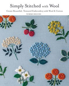 the cover of simply stitched with wool, featuring flowers and leaves on blue fabric