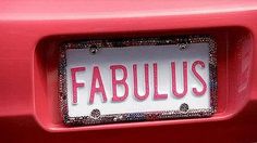 a red car with the word fabulous on it